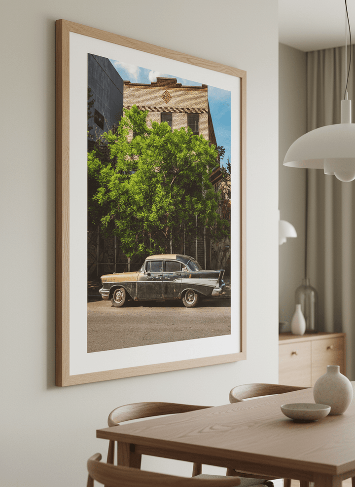Wall art styled above a dining table in a contemporary home