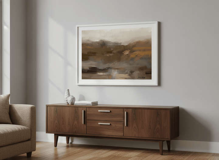 Artwork displayed above a credenza in a real-looking contemporary home