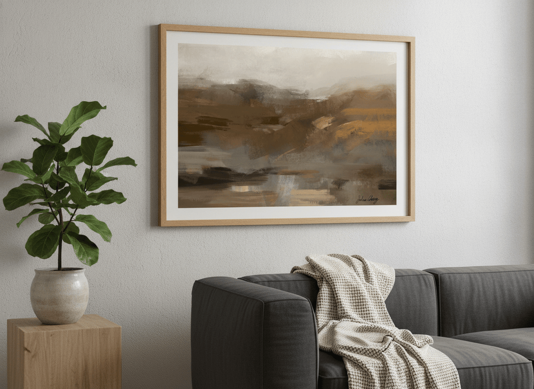 Modern wall art styled above a sofa in a neutral living room