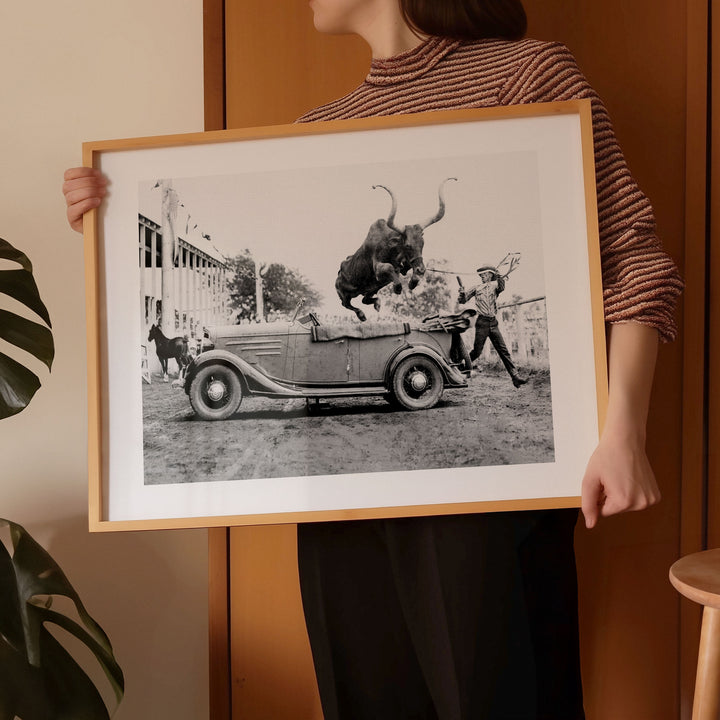 timer wall art bull jumping over car photography girl holding print