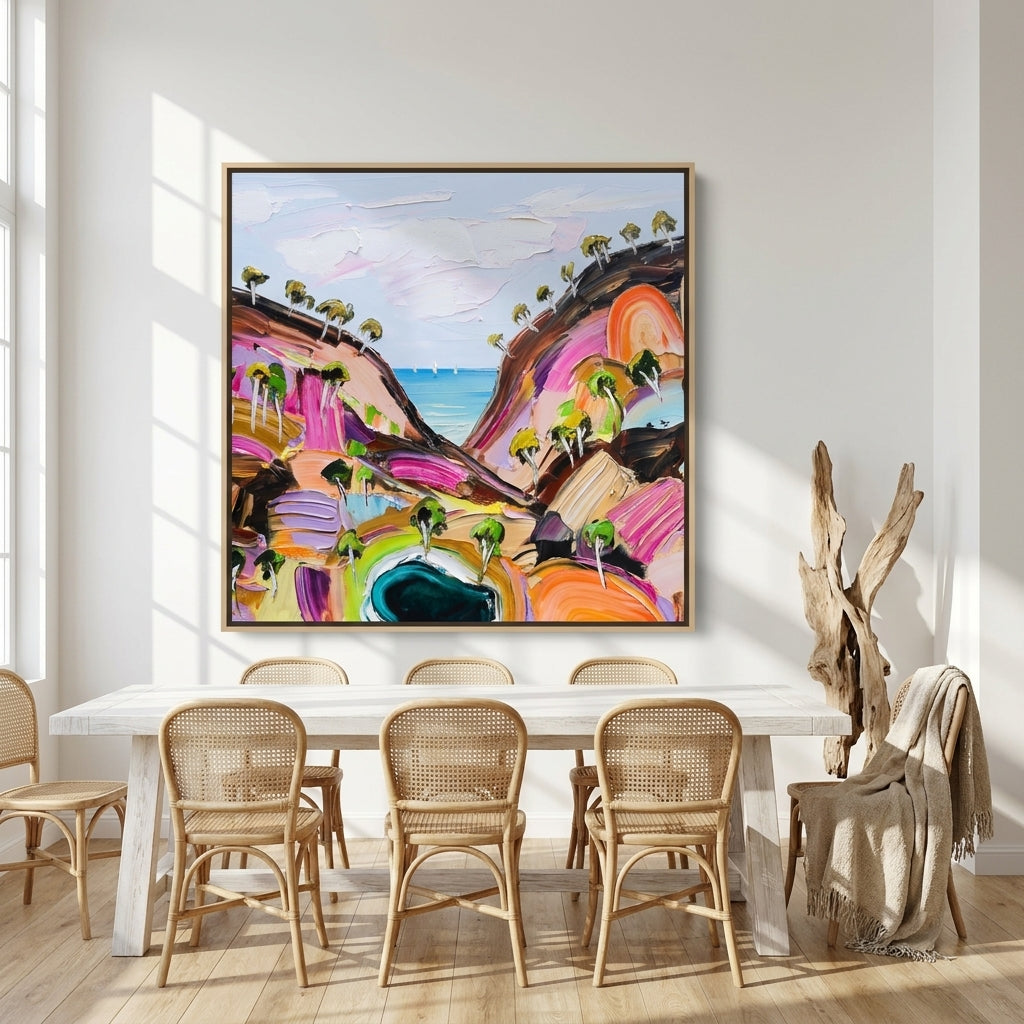 Oversized statement canvas wall art with a natural timber surround styled on the wall in a coastal dining room