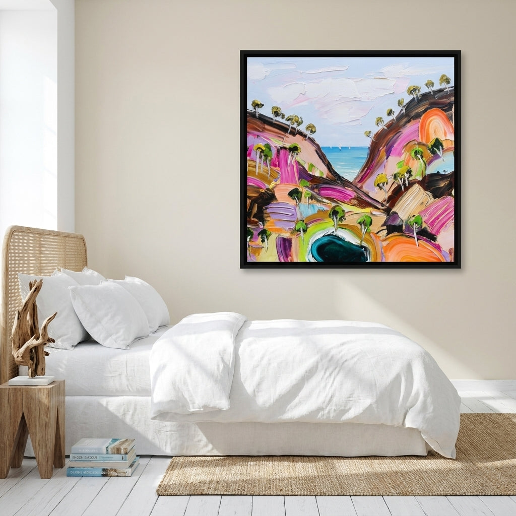 Canvas wall art with a black surround styled on the wall in a coastal bedroom