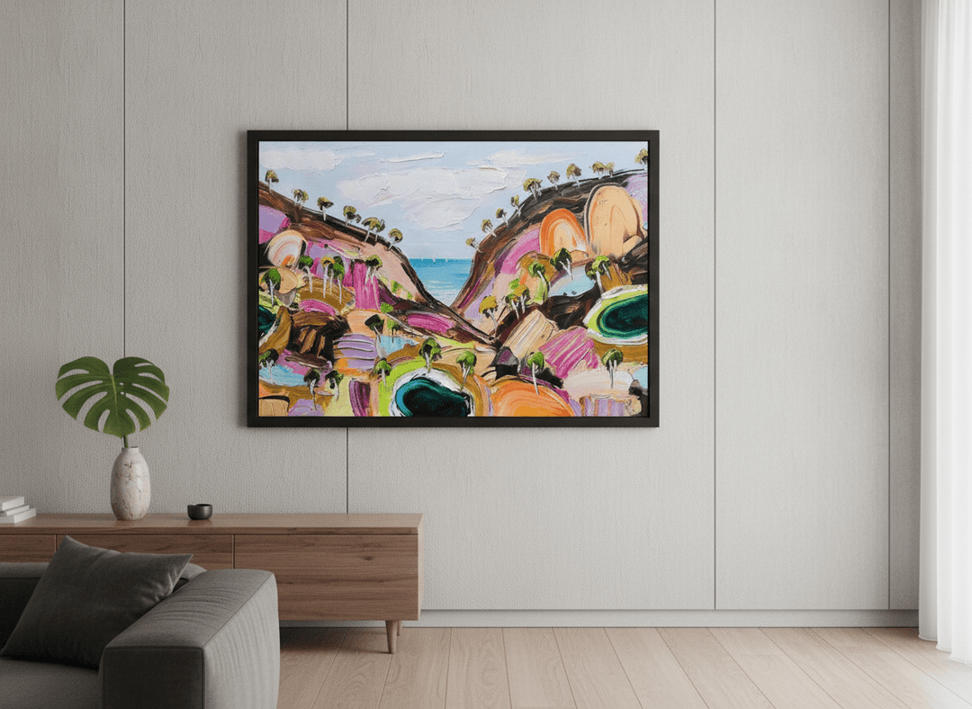 Modern wall art styled above a sofa in a neutral living room