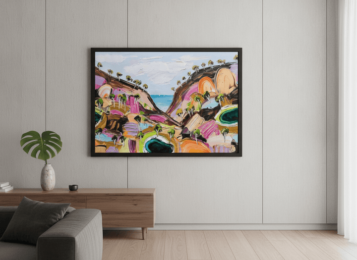 Modern wall art styled above a sofa in a neutral living room