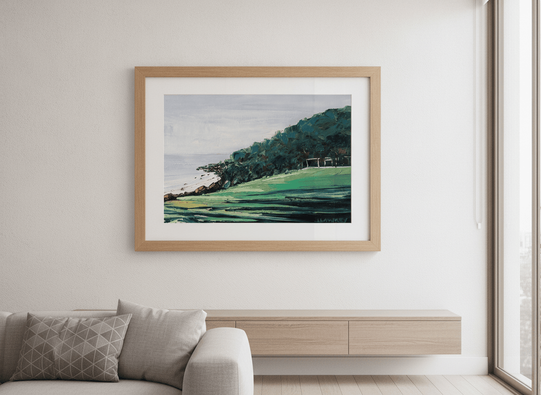Modern wall art styled above a sofa in a neutral living room
