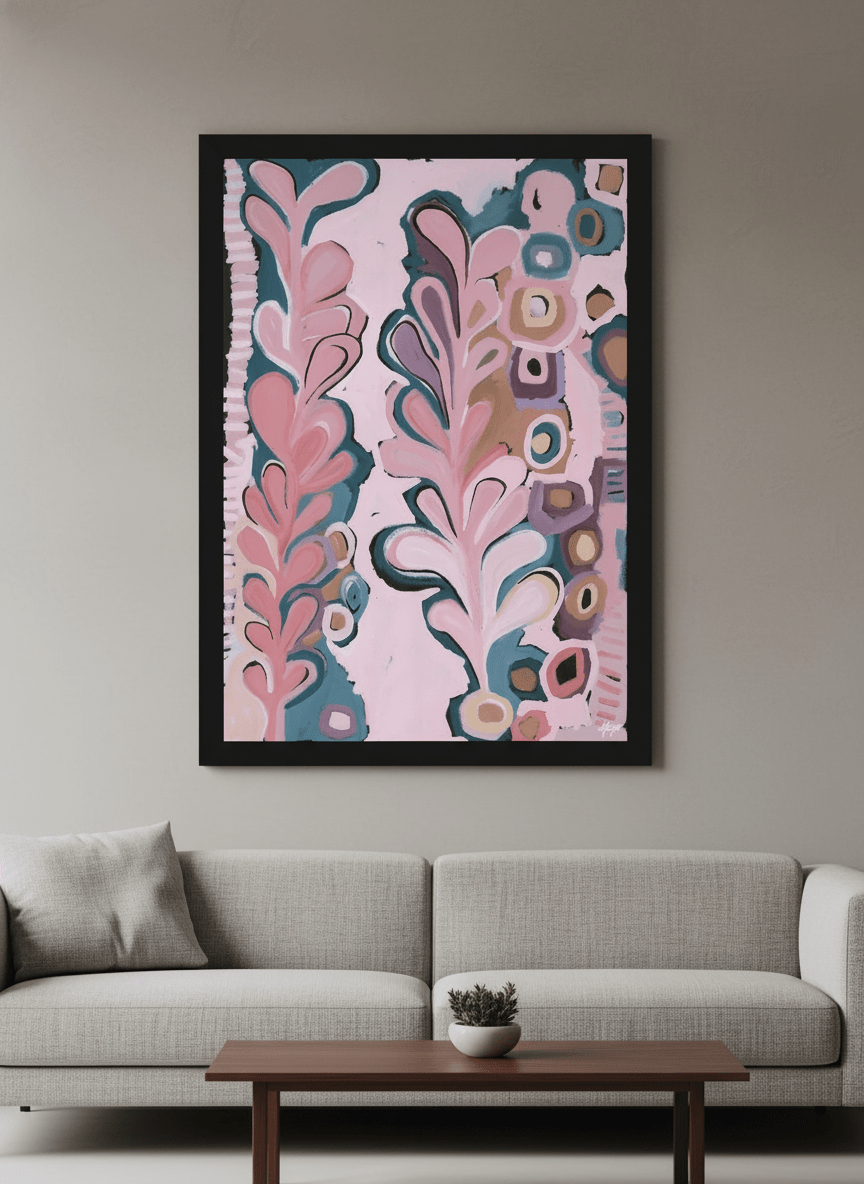 Modern wall art styled above a sofa in a neutral living room