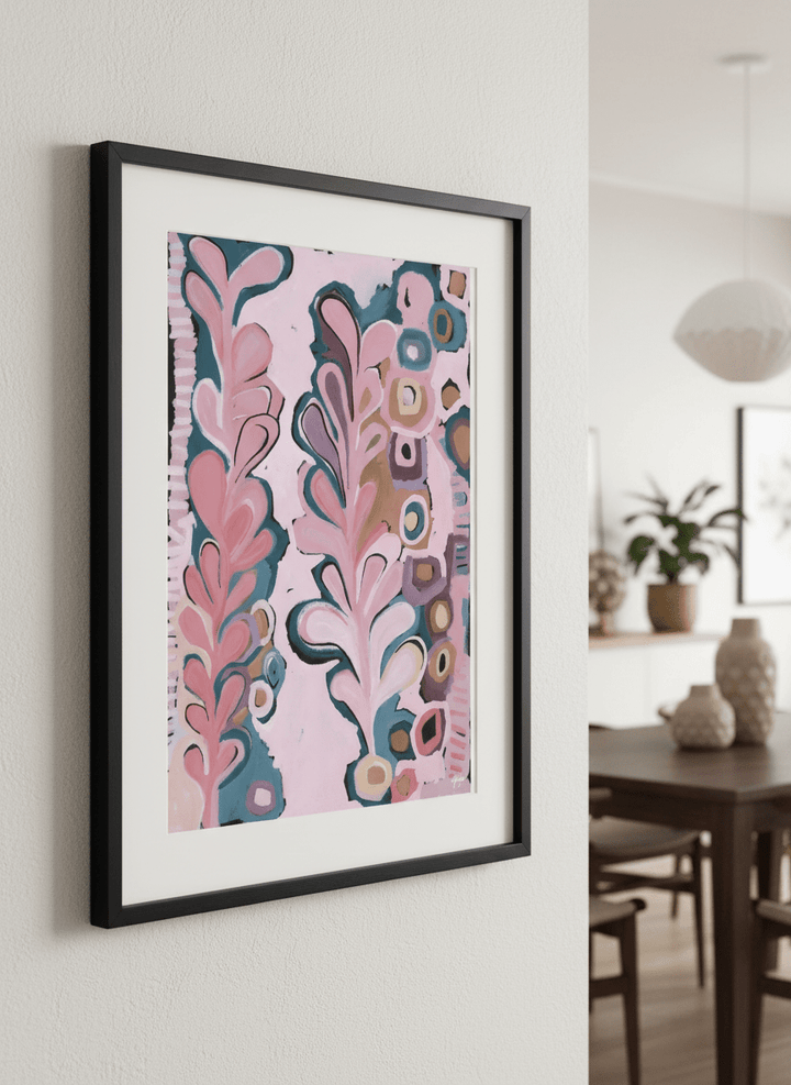 Wall art styled above a dining table in a contemporary home