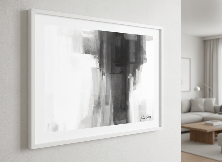 Modern wall art styled above a sofa in a neutral living room