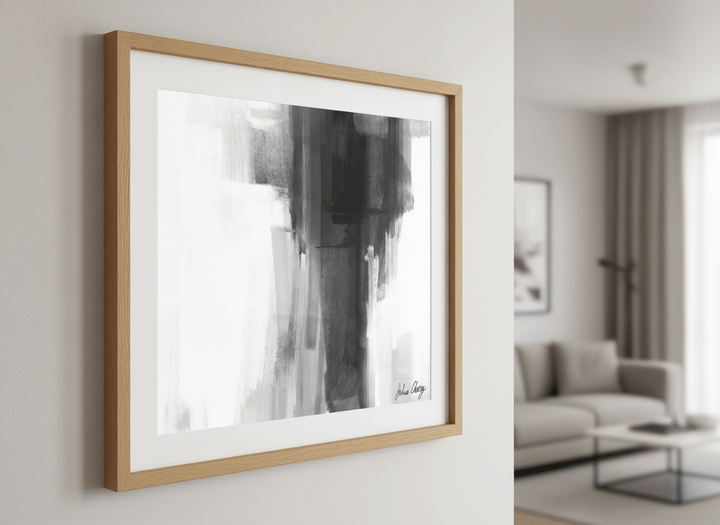 Modern wall art styled above a sofa in a neutral living room