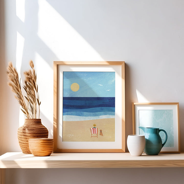 Artwork of a beach scene on a shelf with decorative items.