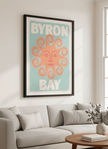 Modern wall art styled above a sofa in a neutral living room