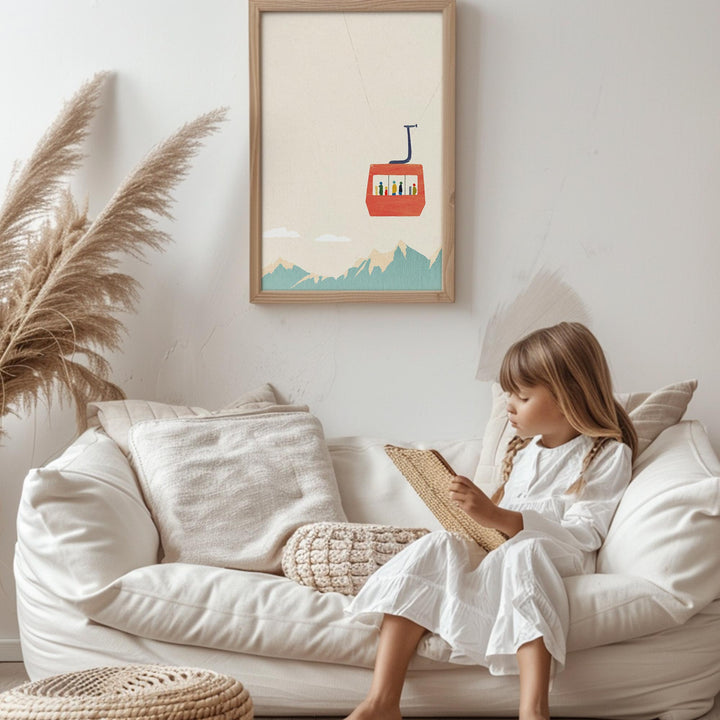 Child reading a book on a white couch with a picture of a red gondola on the wall.