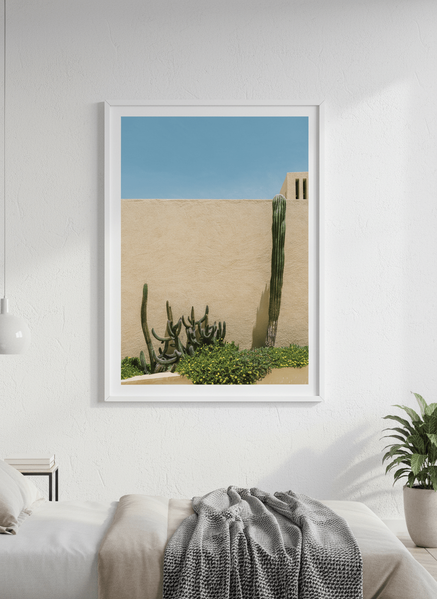 Minimalist artwork displayed in a calm, light-filled bedroom interior