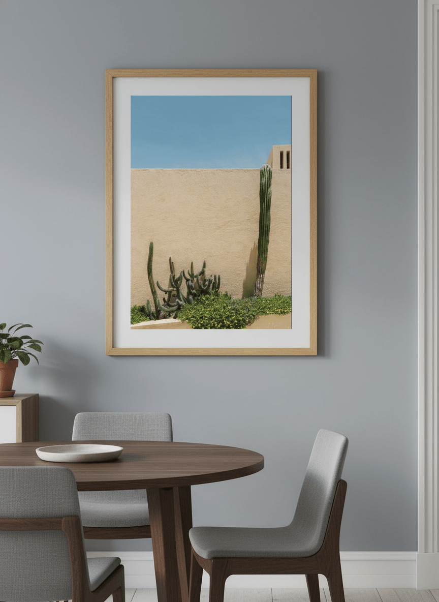 Wall art styled above a dining table in a contemporary home