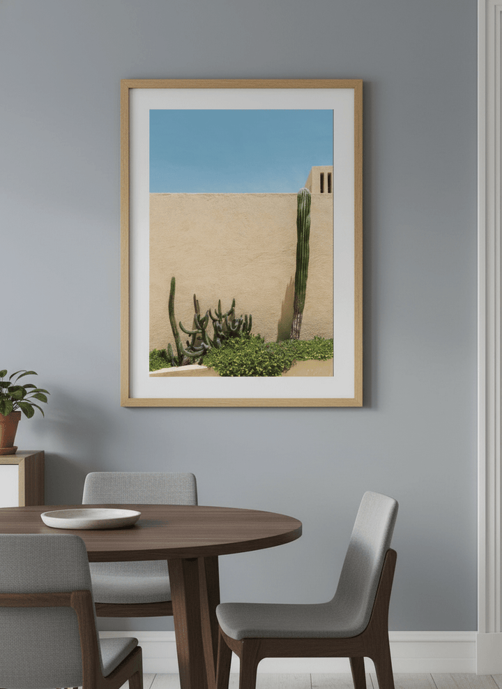 Wall art styled above a dining table in a contemporary home
