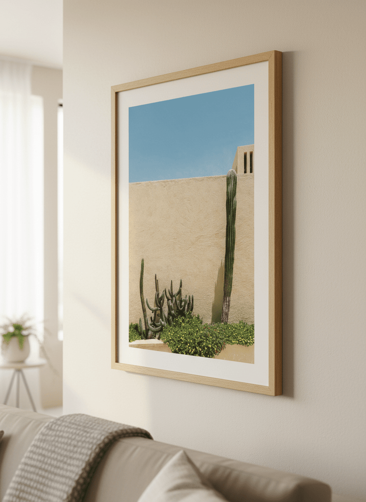 Modern wall art styled above a sofa in a neutral living room
