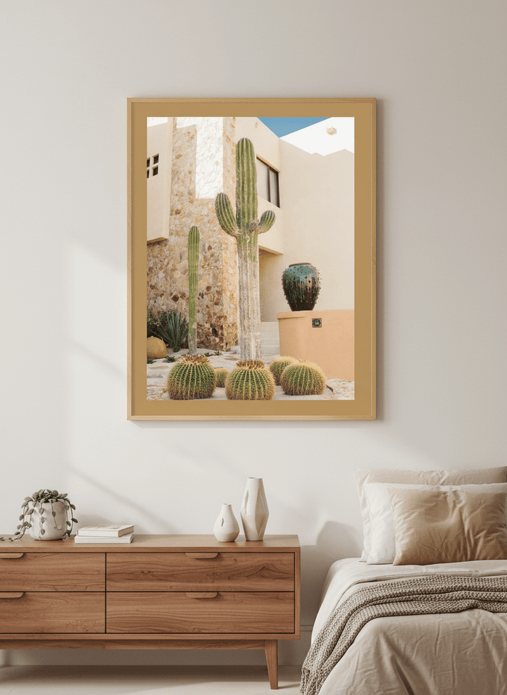 Minimalist artwork displayed in a calm, light-filled bedroom interior