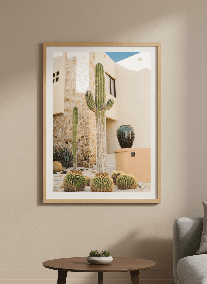 Modern wall art styled above a sofa in a neutral living room
