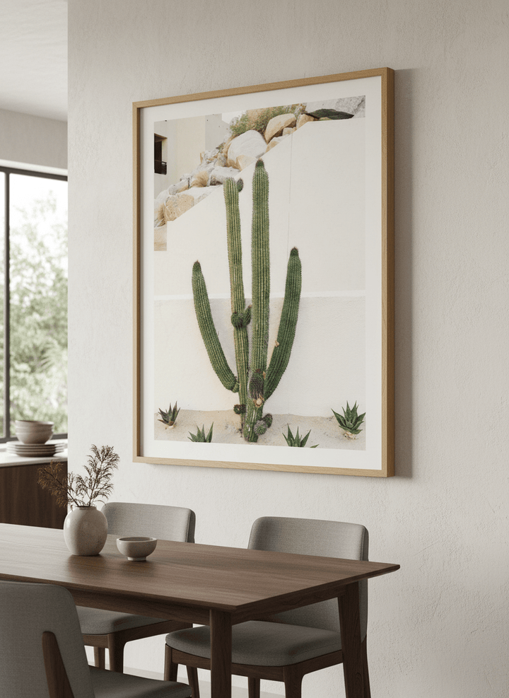 Wall art styled above a dining table in a contemporary home