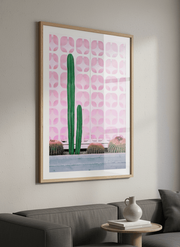 Modern wall art styled above a sofa in a neutral living room