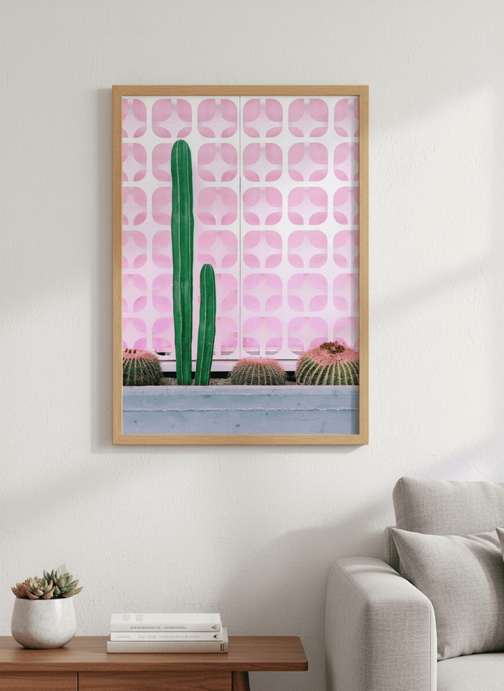 Modern wall art styled above a sofa in a neutral living room