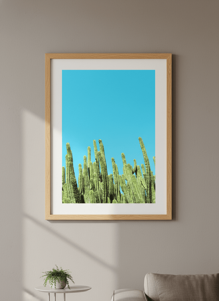 Modern wall art styled above a sofa in a neutral living room