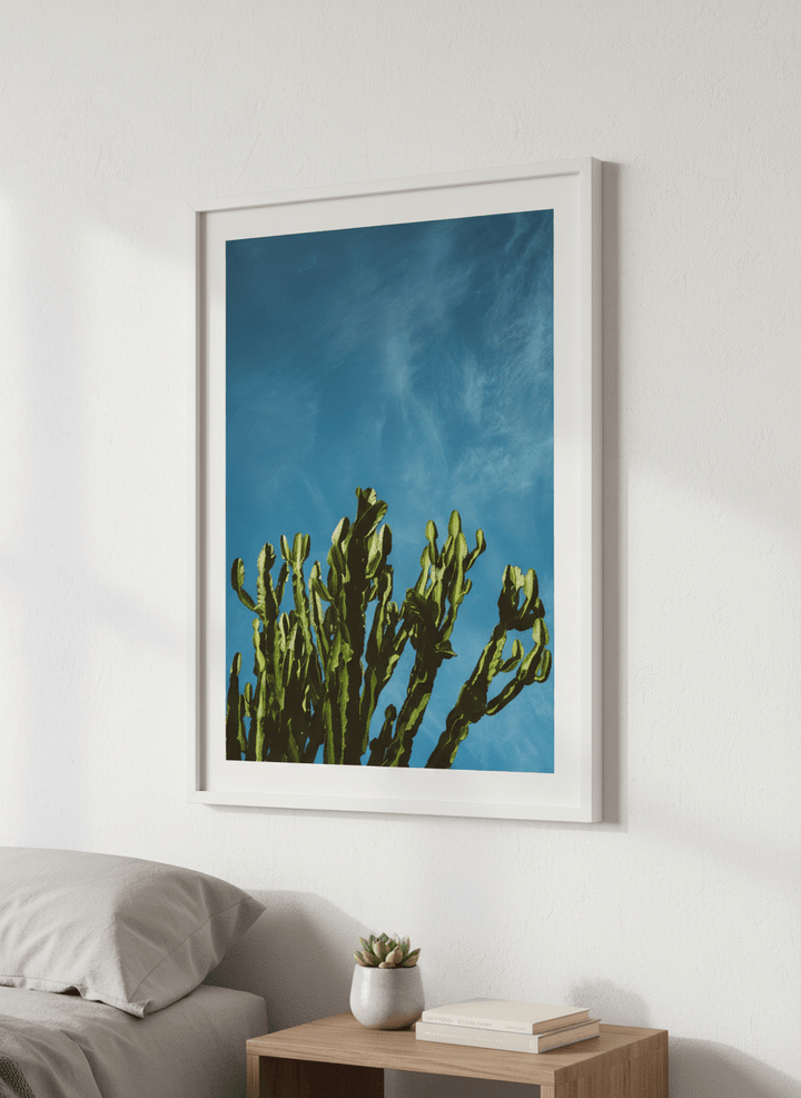 Minimalist artwork displayed in a calm, light-filled bedroom interior