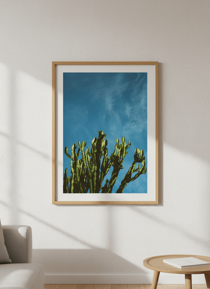 Modern wall art styled above a sofa in a neutral living room