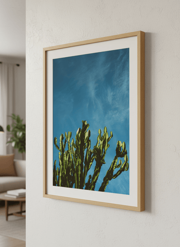 Modern wall art styled above a sofa in a neutral living room