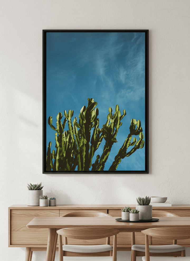 Wall art styled above a dining table in a contemporary home