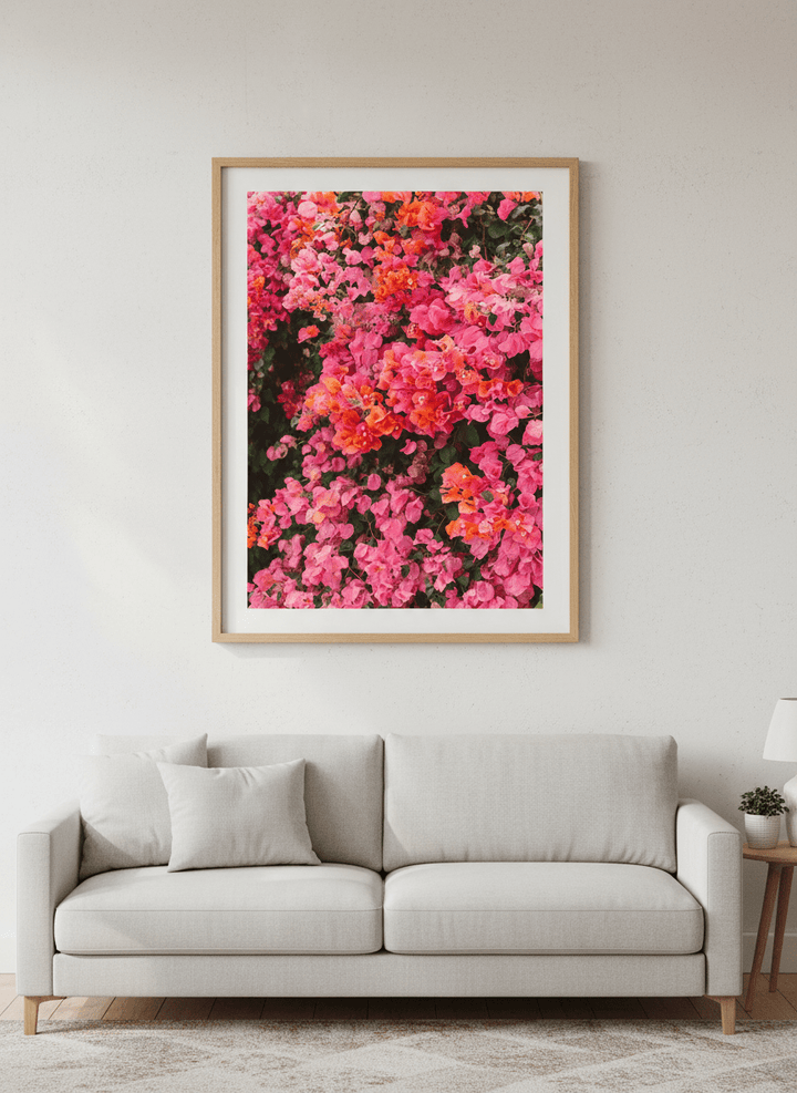 Modern wall art styled above a sofa in a neutral living room
