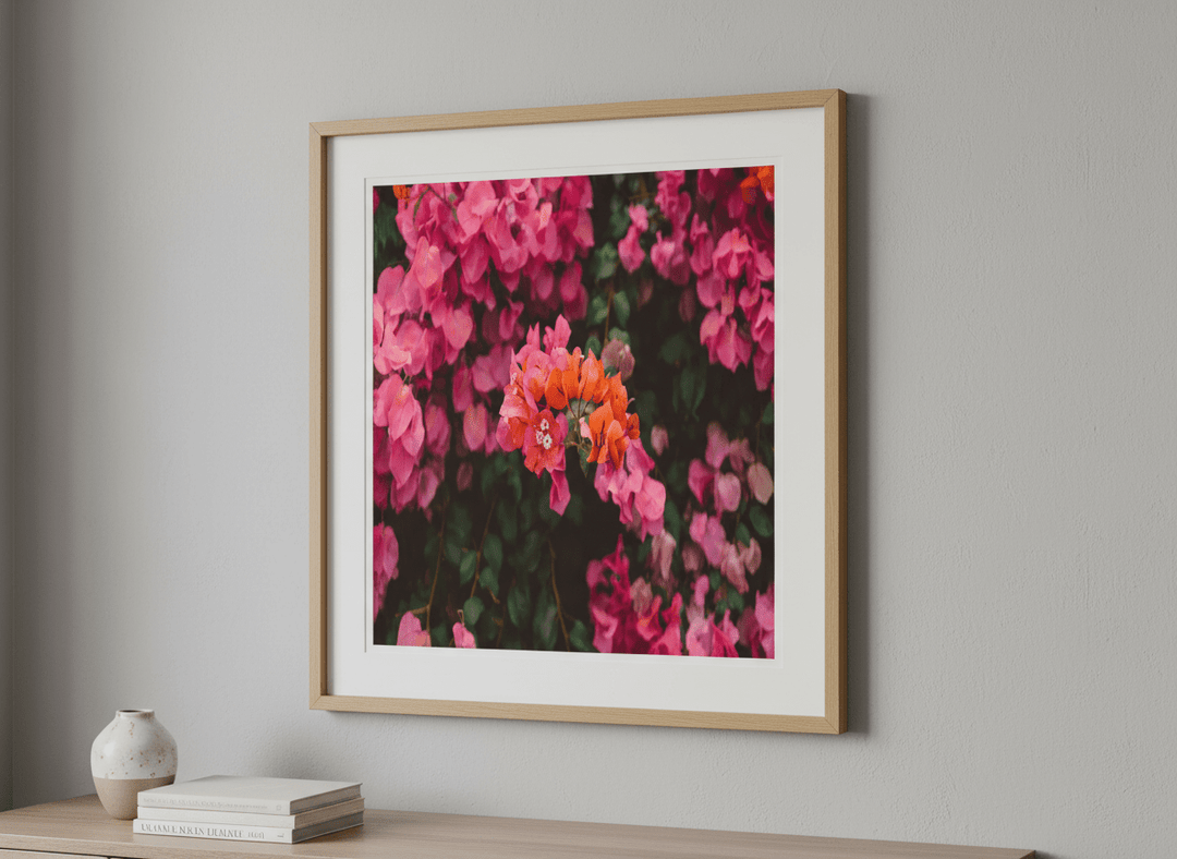 Modern wall art styled above a sofa in a neutral living room