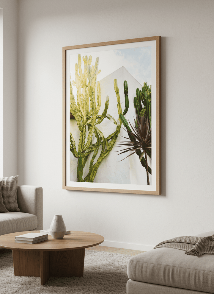 Modern wall art styled above a sofa in a neutral living room
