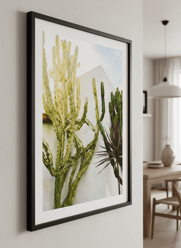 Wall art styled above a dining table in a contemporary home