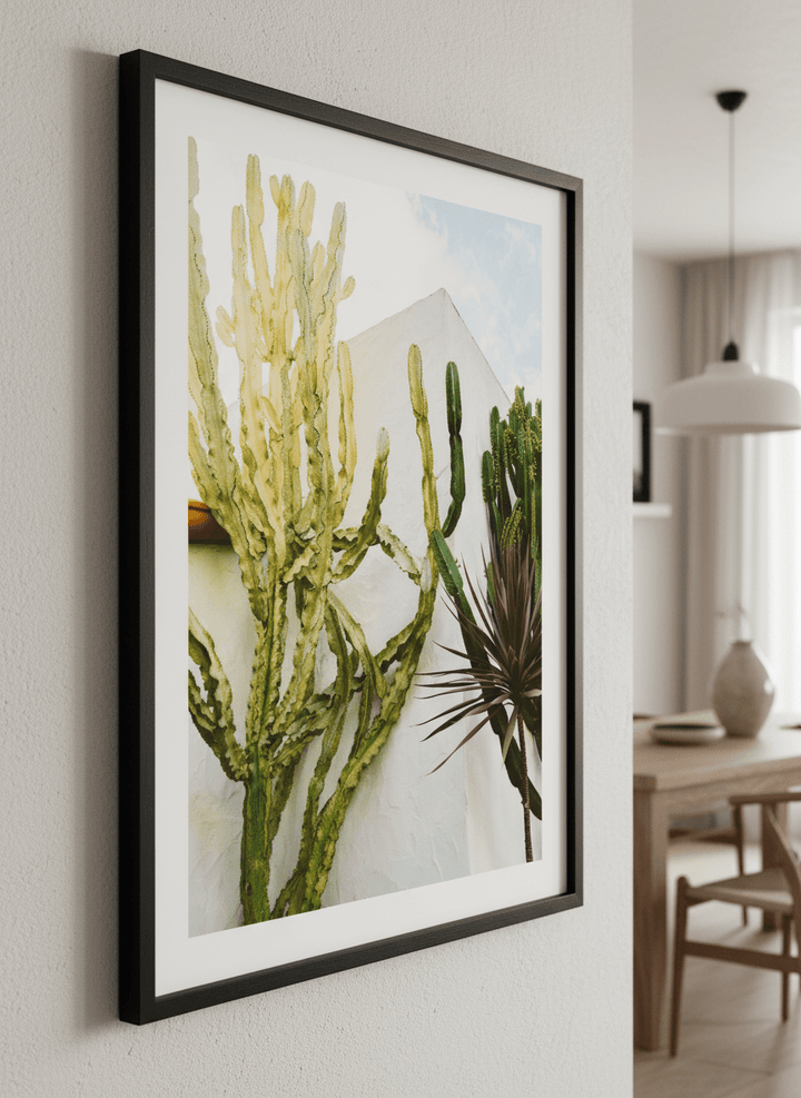 Wall art styled above a dining table in a contemporary home