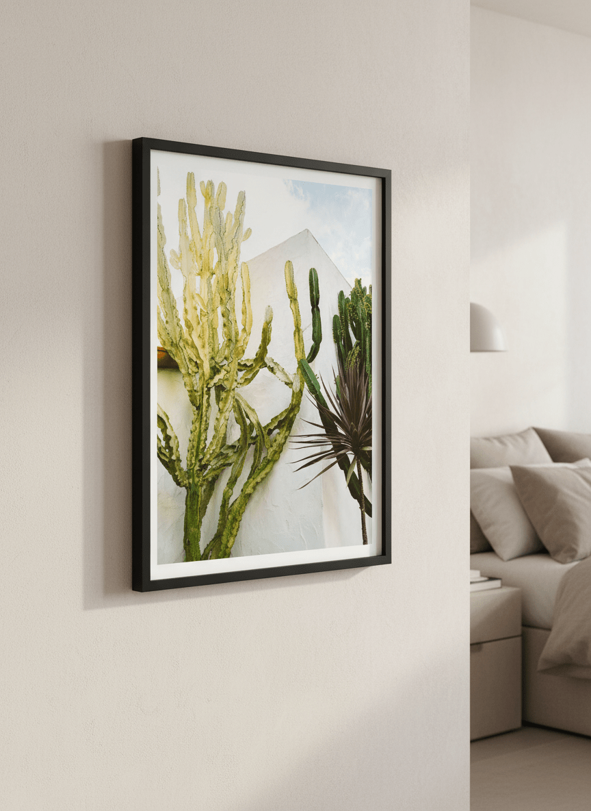 Minimalist artwork displayed in a calm, light-filled bedroom interior