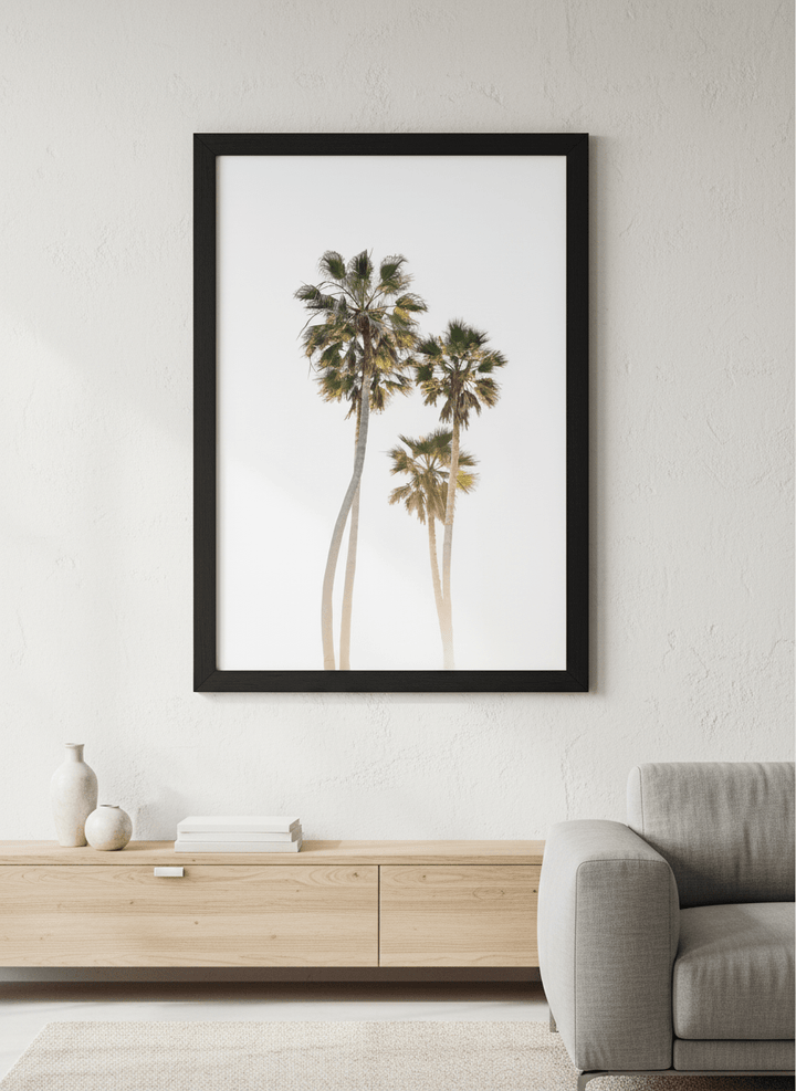 Modern wall art styled above a sofa in a neutral living room