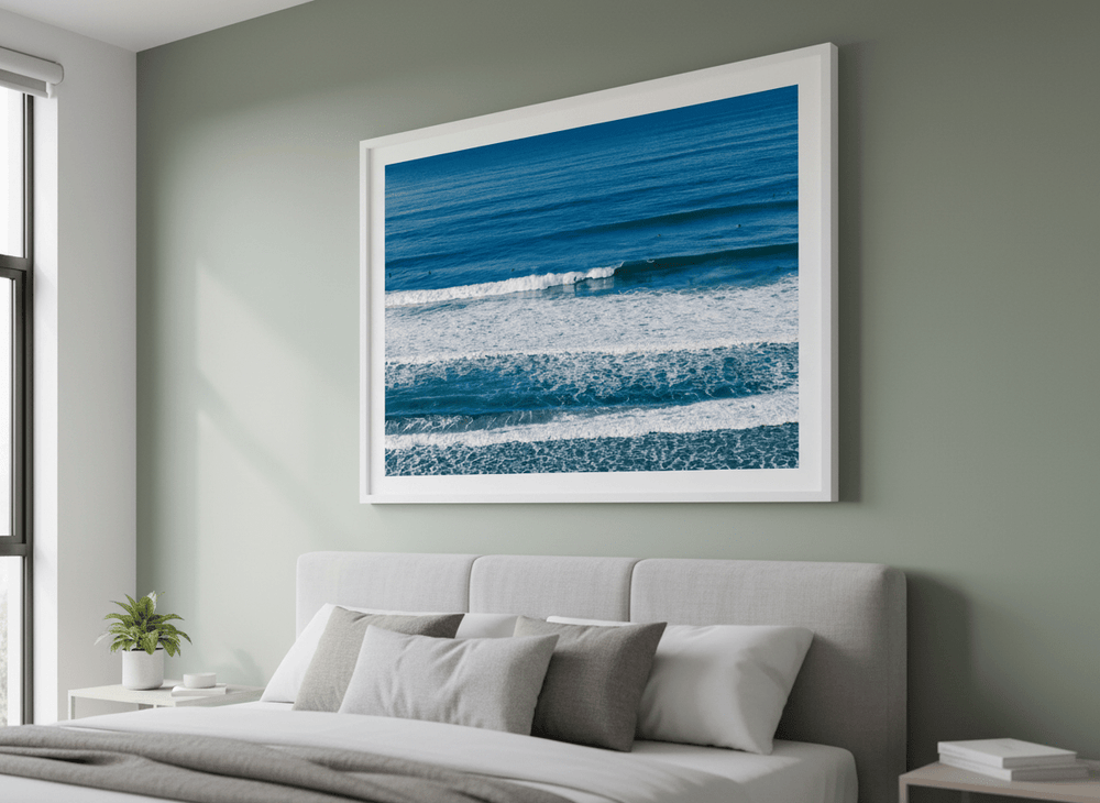 Minimalist artwork displayed in a calm, light-filled bedroom interior