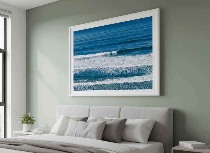 Minimalist artwork displayed in a calm, light-filled bedroom interior