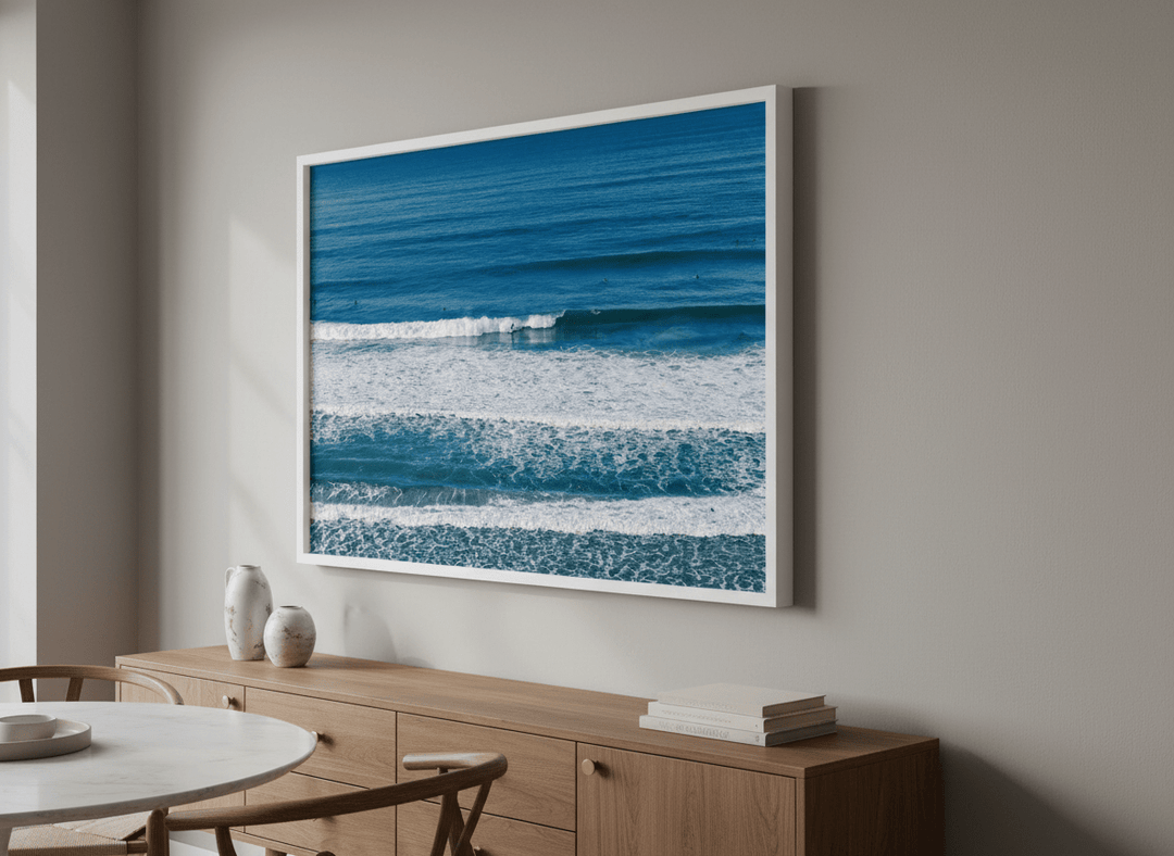 Wall art styled above a dining table in a contemporary home