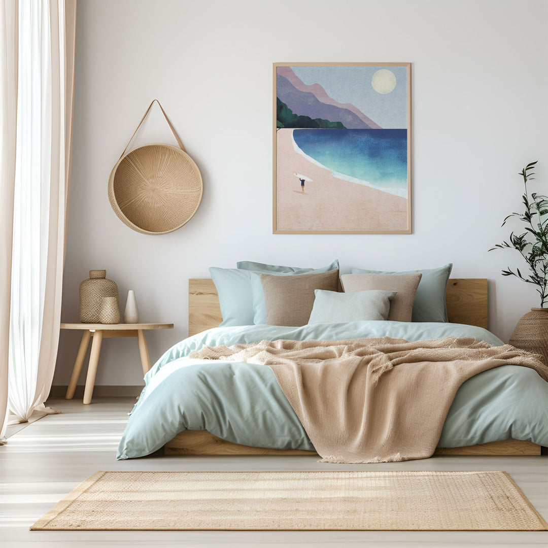 Modern bedroom with a bed, artwork of a beach scene, and decorative items.