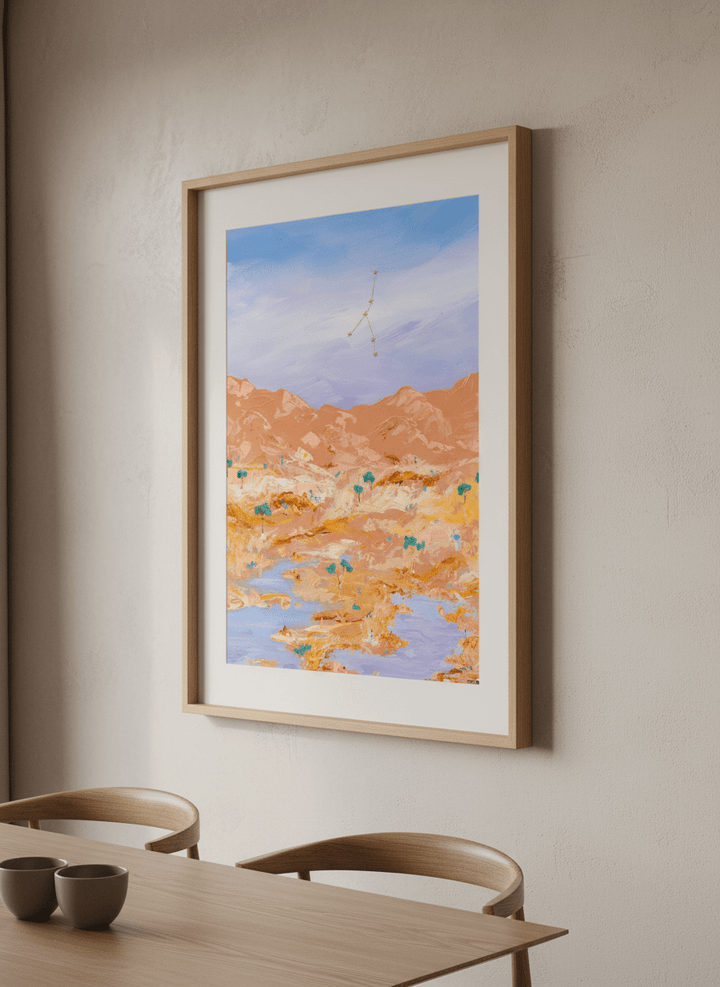 Wall art styled above a dining table in a contemporary home