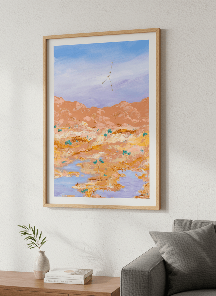 Modern wall art styled above a sofa in a neutral living room
