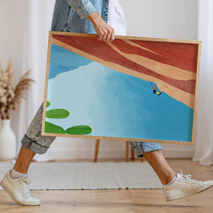 Person walking holding artwork