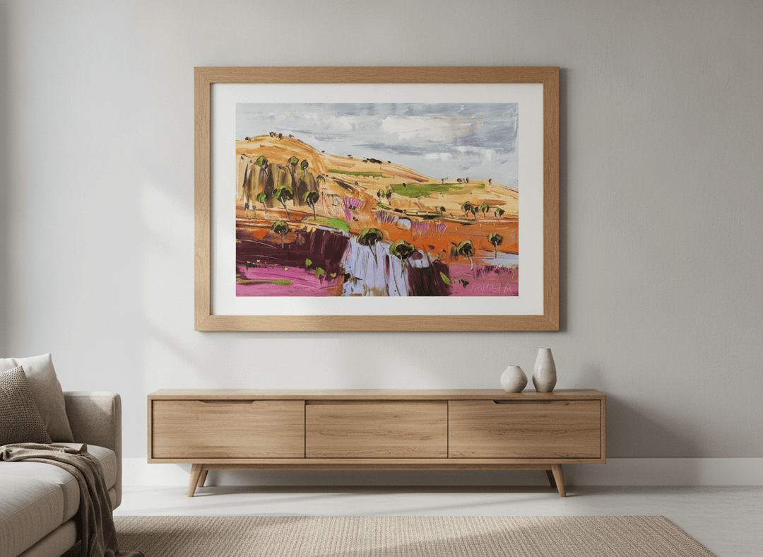 Modern wall art styled above a sofa in a neutral living room