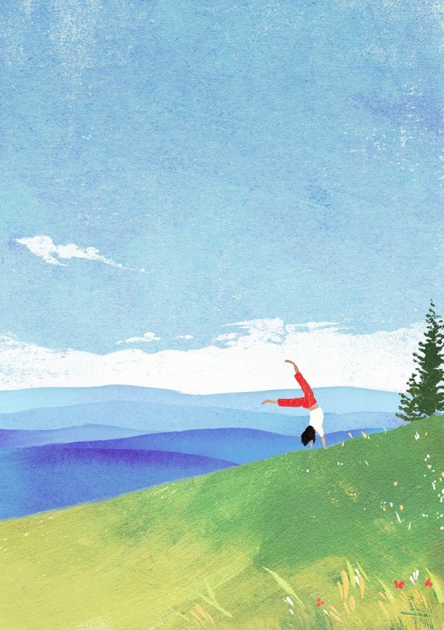 Person in a red jacket standing on a grassy hill with a blue sky and mountains in the background. framed