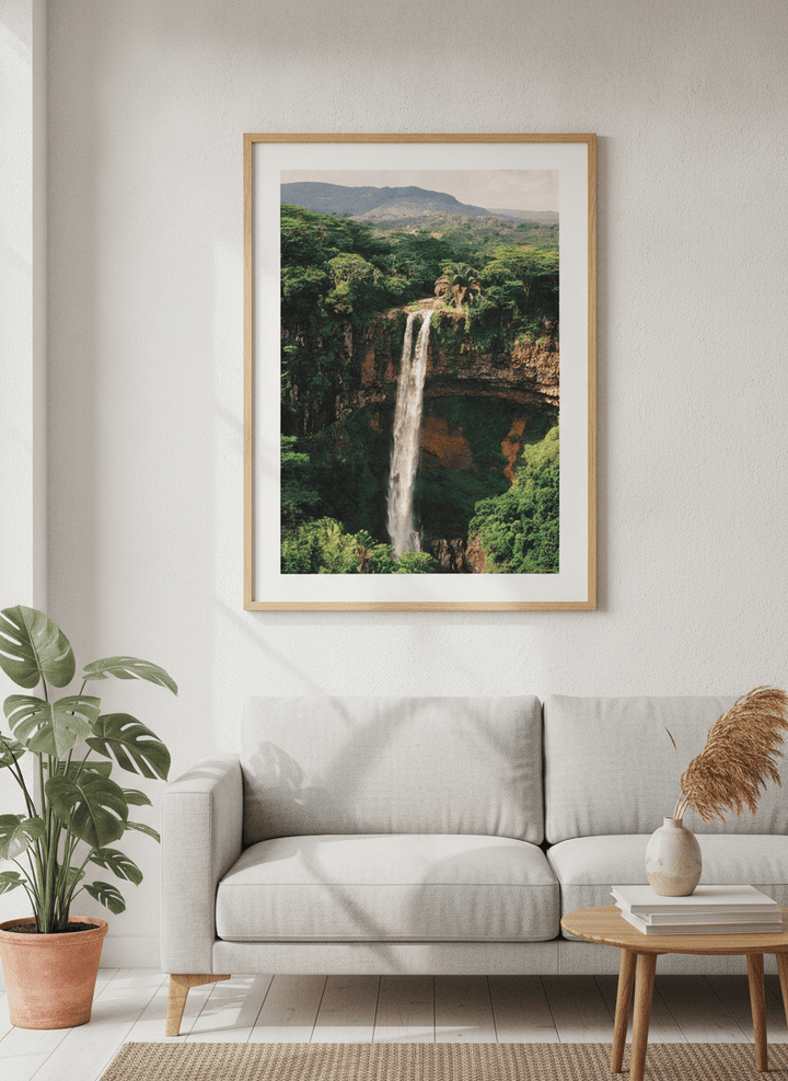 Modern wall art styled above a sofa in a neutral living room