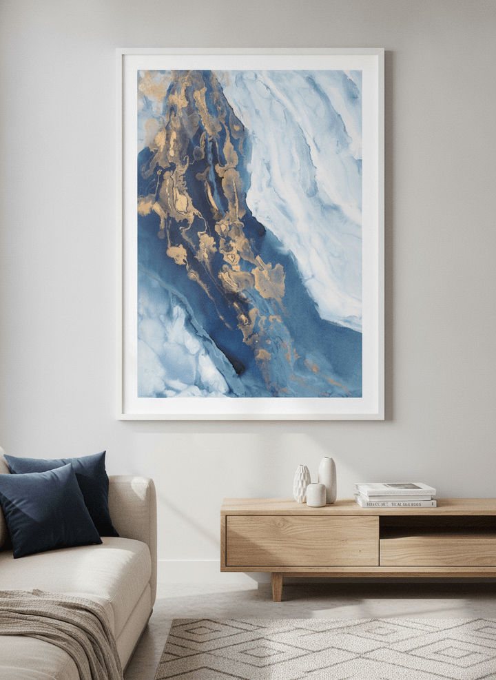 Modern wall art styled above a sofa in a neutral living room