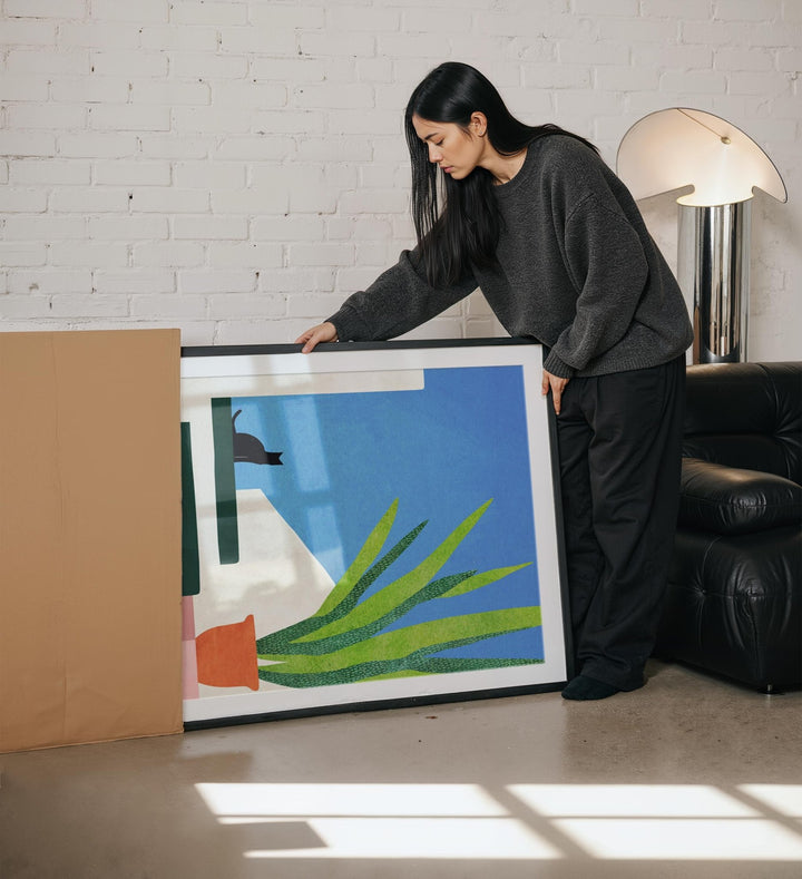 girl unboxing an artwork