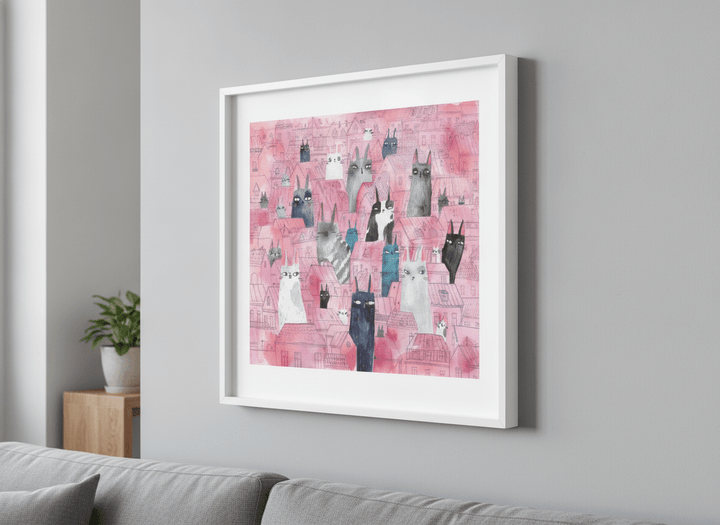 Modern wall art styled above a sofa in a neutral living room
